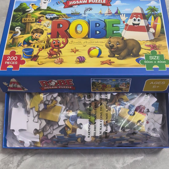 Colourful Obie the Obelisk Robe jigsaw puzzle featuring Obie, the iconic ROBE sign, beach scenes, boats, Australian wildlife and seaside adventures in Robe, South Australia.