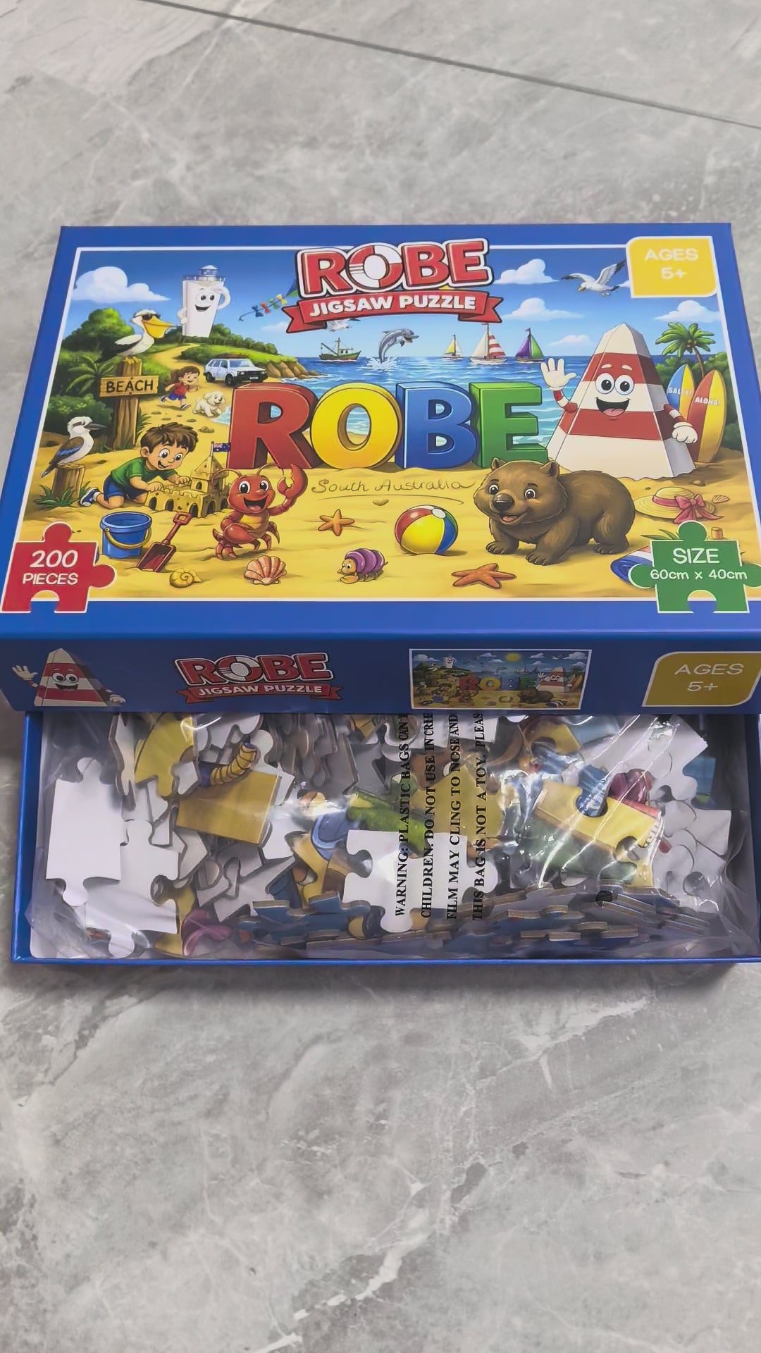Colourful Obie the Obelisk Robe jigsaw puzzle featuring Obie, the iconic ROBE sign, beach scenes, boats, Australian wildlife and seaside adventures in Robe, South Australia.