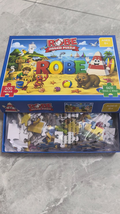 Colourful Obie the Obelisk Robe jigsaw puzzle featuring Obie, the iconic ROBE sign, beach scenes, boats, Australian wildlife and seaside adventures in Robe, South Australia.